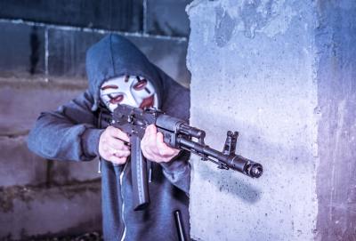 Masked man with a gun